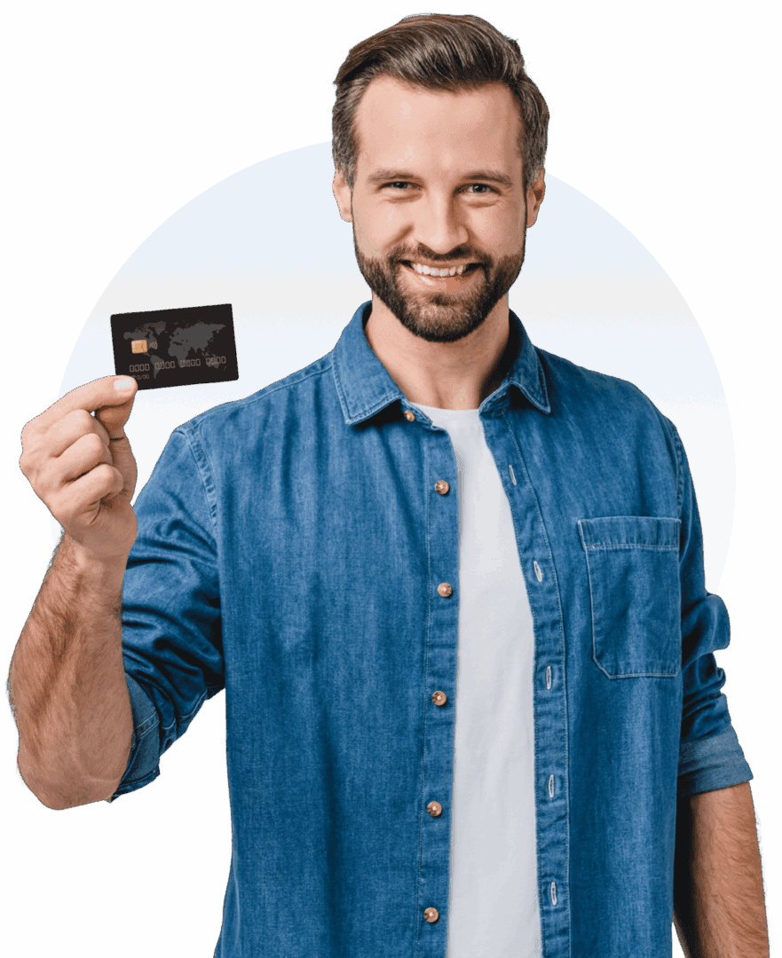 Man holding a credit card, smiling.